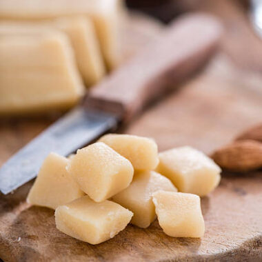 Raw marzipan (close up shot) on vintage wooden background