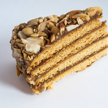 Piece of honey cake with peanuts